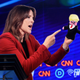 Illustration for article titled Marianne Williamson Sternly Addresses Homemade Trump Puppet About Immigration In Fiery Debate Exchange